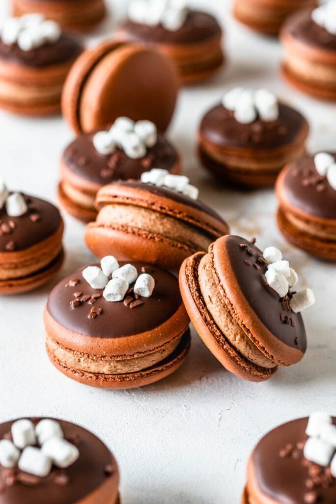 Chocolate macarons on plate 
