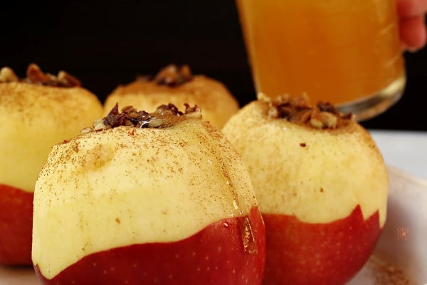 apple cider appes on counter with sauce in glass jar