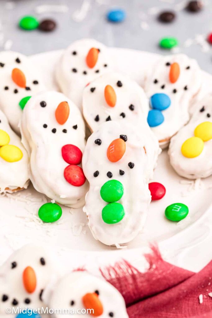 nutter butter cookies decorated like snowmen 