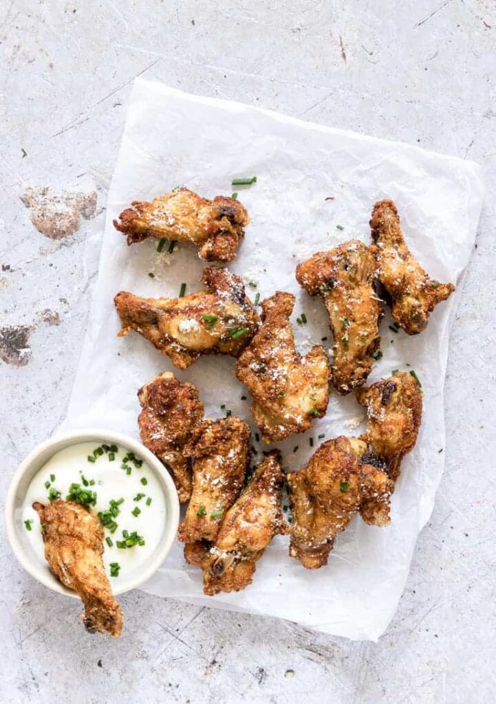 parmesan chicken wings on parchment paper 