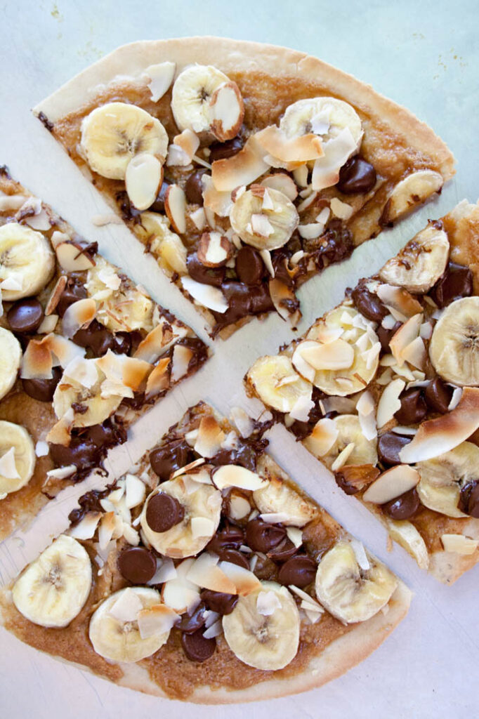 sliced banana pizza on plate 