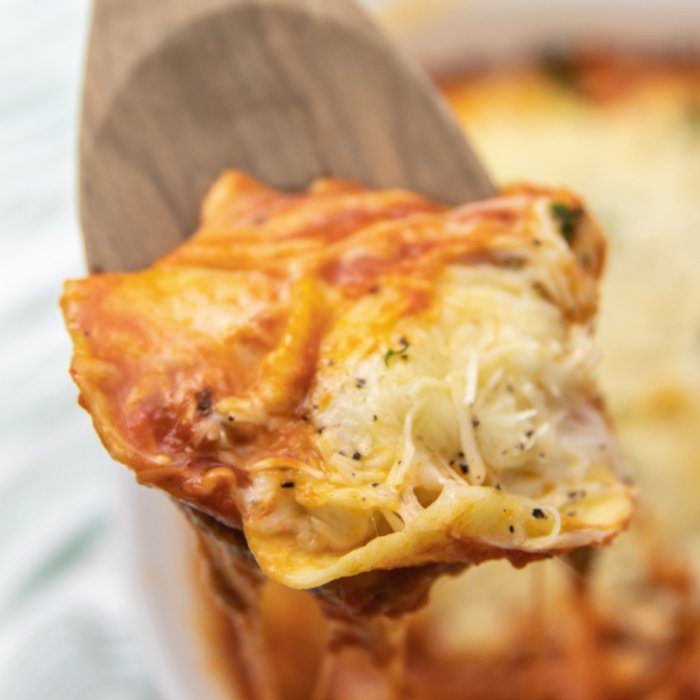 wooden spoon with cheesy ravioli