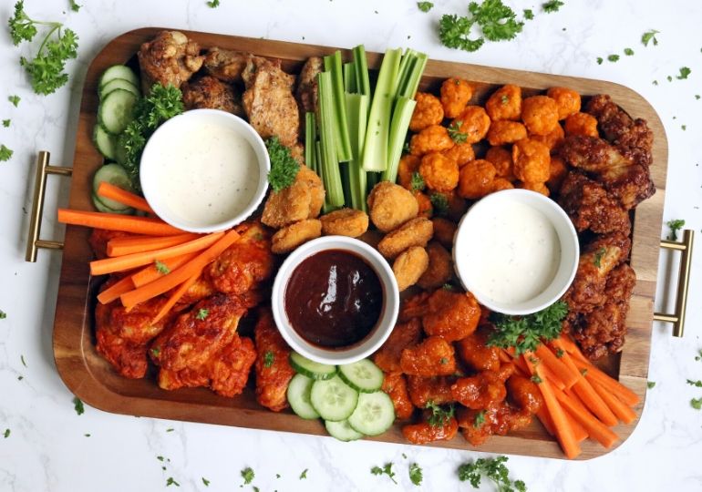 chicken wings on a charcuterie board 