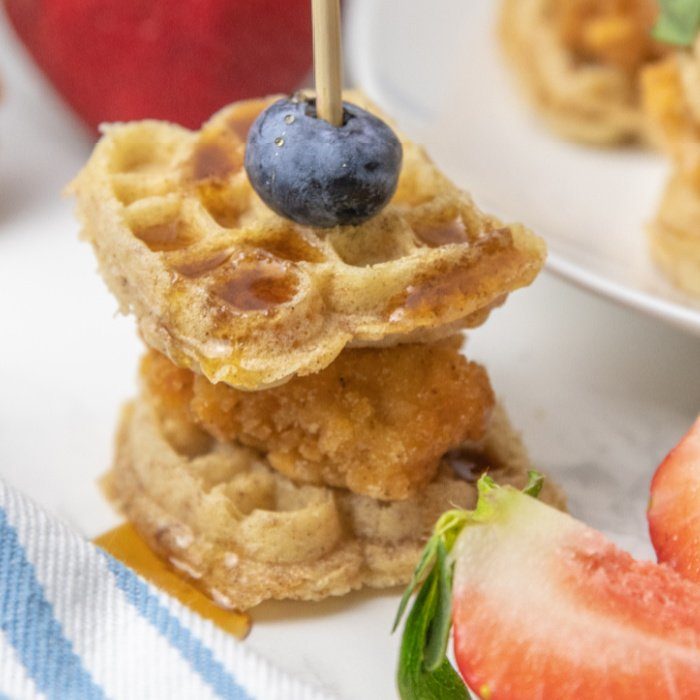 Chicken and Waffle Sliders are a great breakfast, lunch, or even appetizer. Breaded chicken and mini waffles topped with a drizzle of syrup. #passion4savings #waffles #chicken #chickenandwaffle #breakfast #sliders #appetizer #easy #quick chicken and waffle