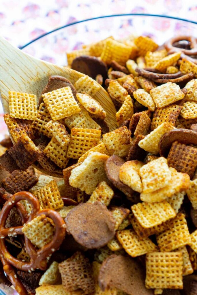 chex mix with spoon in bowl 
