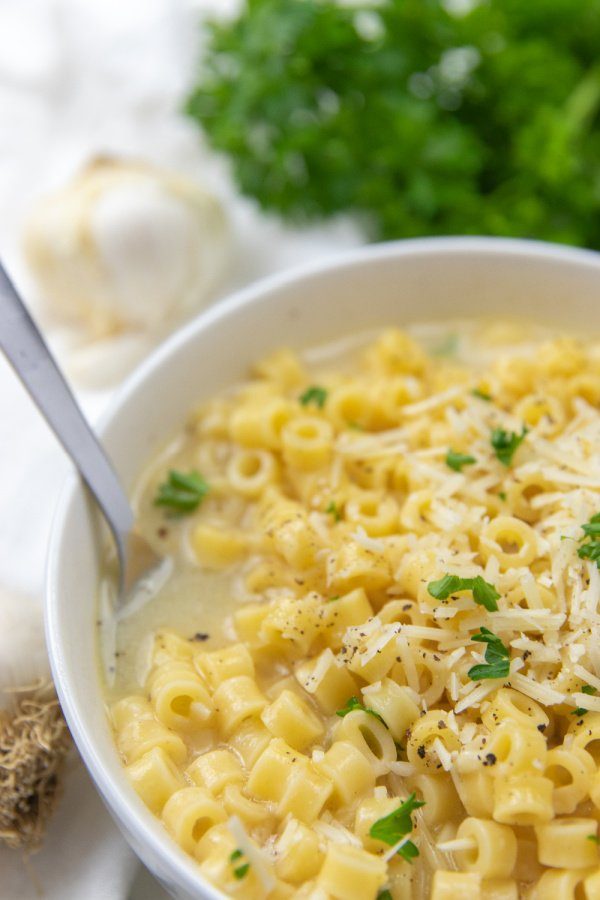 soup in a bowl with a spoon on the side 