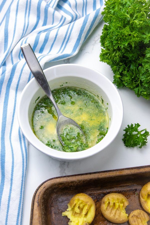 butter and parsley in a white bowl 