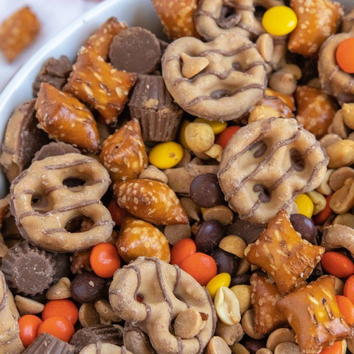 pretzels with peanut butter and Reeses pieces in bowl 