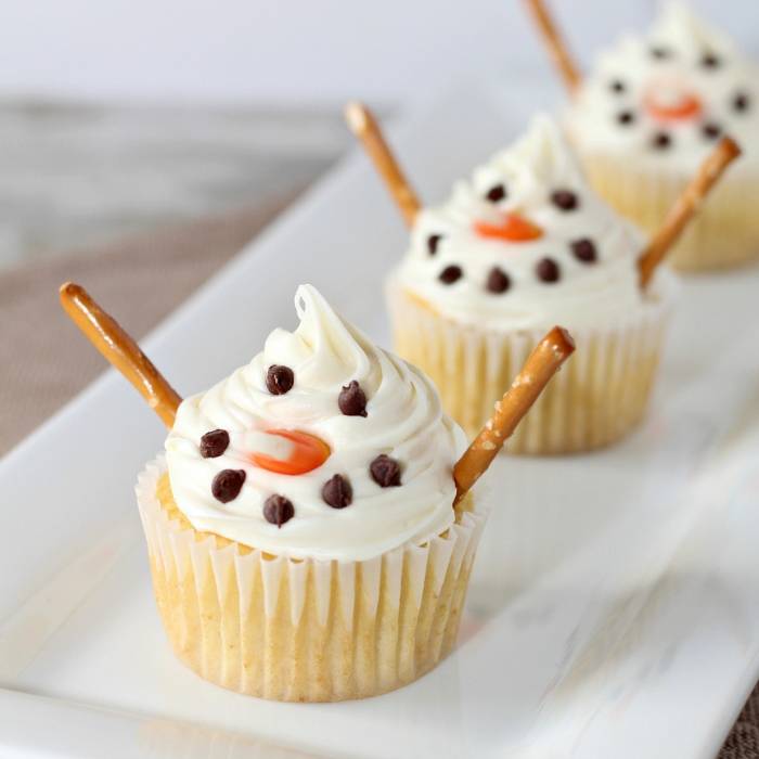 snowman cupcakes on a white tray 