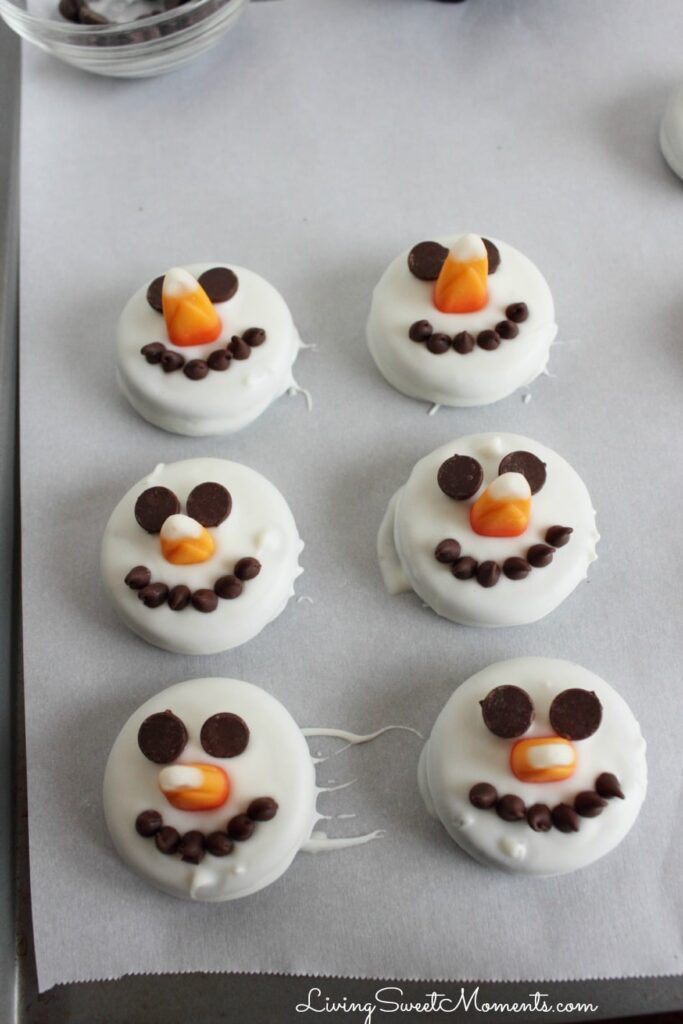 Oreo snowman cookies on wax paper 