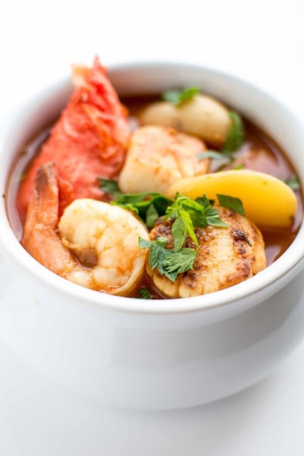 seafood stew in white bowl 