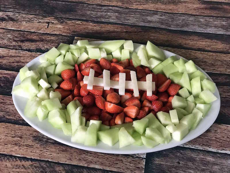 football fruit platter on wooden table 