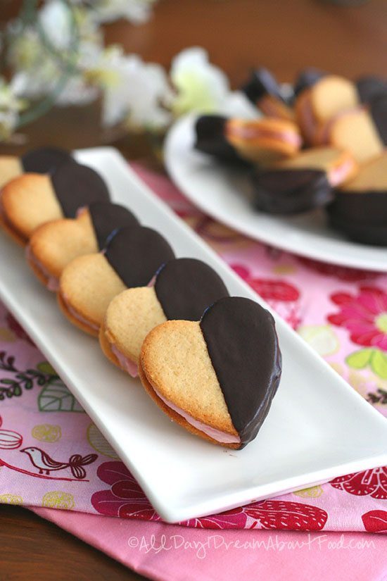 sandwich strawberry and cream heart cookies on tray 