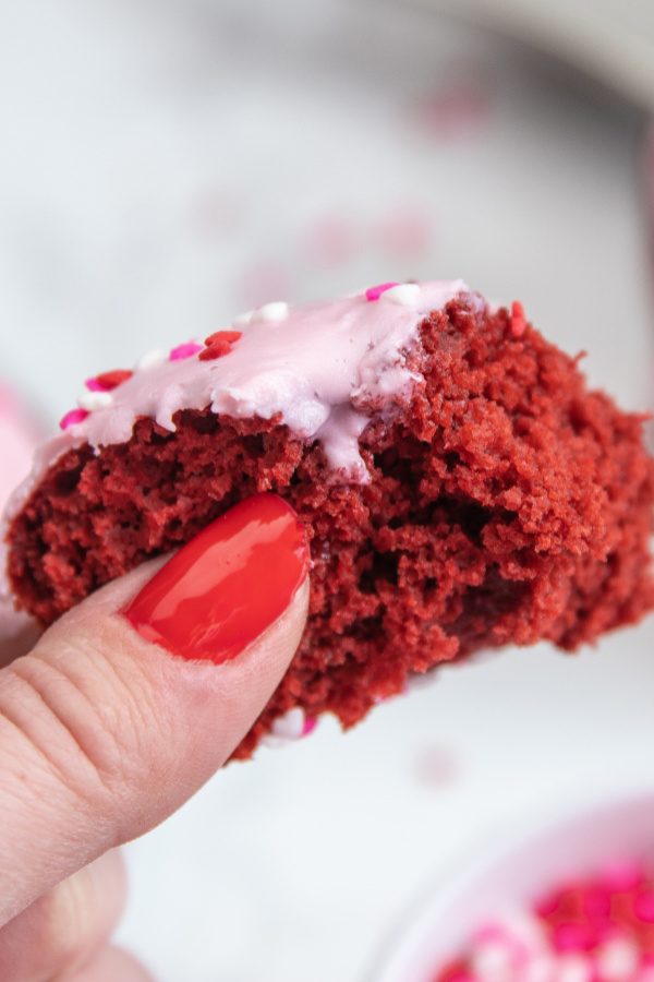 bitten donut in hand 