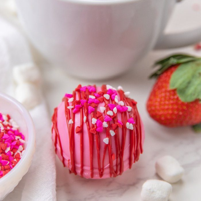 strawberry hot chocolate bomb on table
