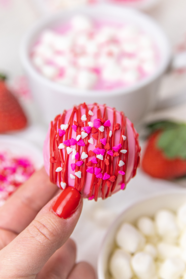 valentine hot chocolate bomb in hand 