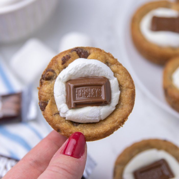 holding a mini cookie cup