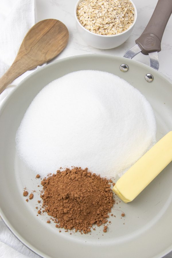 Nutella No Bake Cookies are a spin on a classic oatmeal no bake cookie. Added hazelnut spread gives these cookies an irresistible flavor. #passion4savings #nutella #hazelnut #cookies #nobakes #oatmeal #dessert #easy # butter sugar and cocoa in skillet