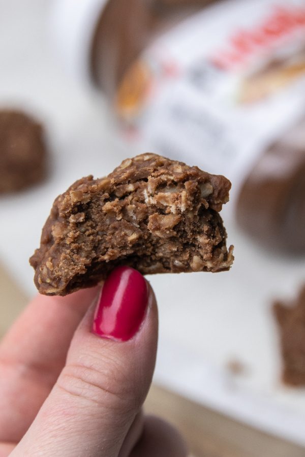 oatmeal no bake cookie in hand with bite taken out 