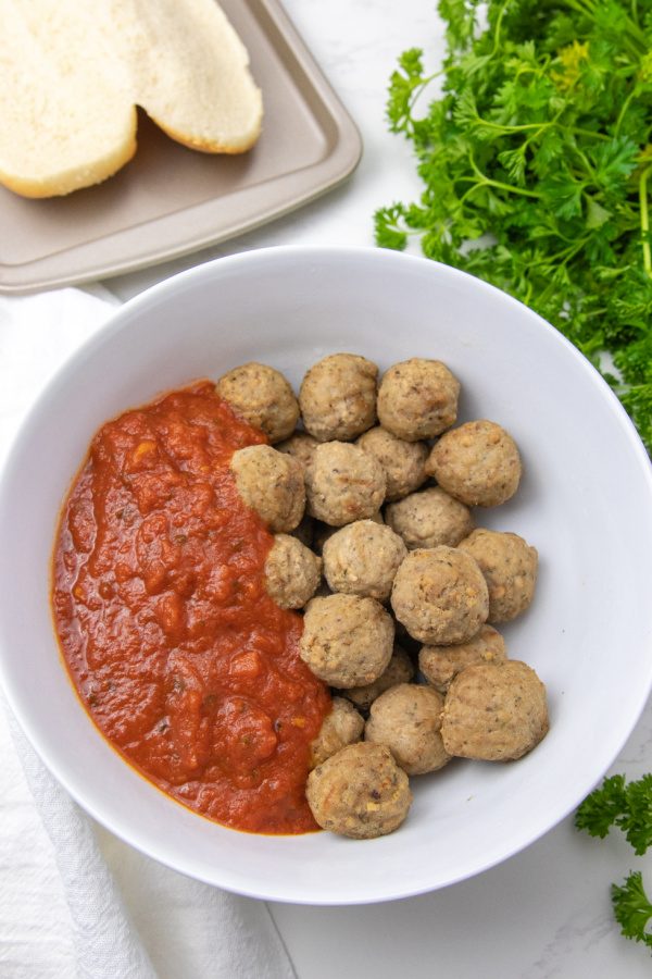 meatballs and marinara in a bowl on table