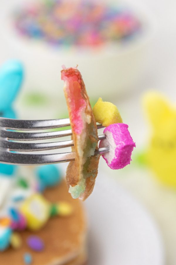Easter peeps pancakes are a fluffy pancake filled with bits of peeps. This is a marshmallow pancake perfect for Easter morning breakfast. #passion4savings #easter #pancakes #peeps #tradition #spring #morning #eastermorning Pancake For Easter