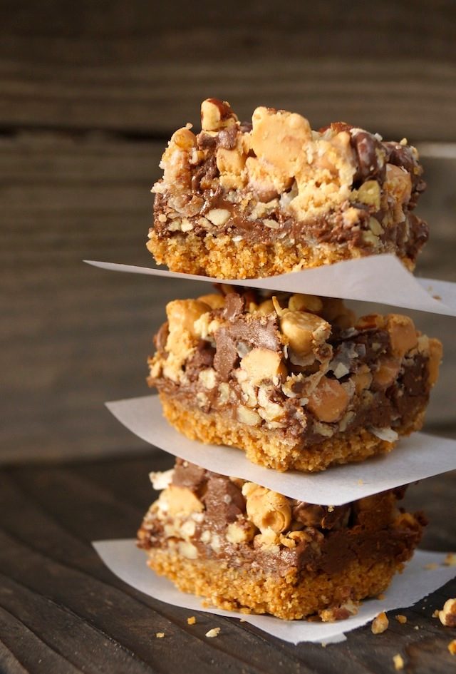 peanut butter magic bars stacked on top of each other 