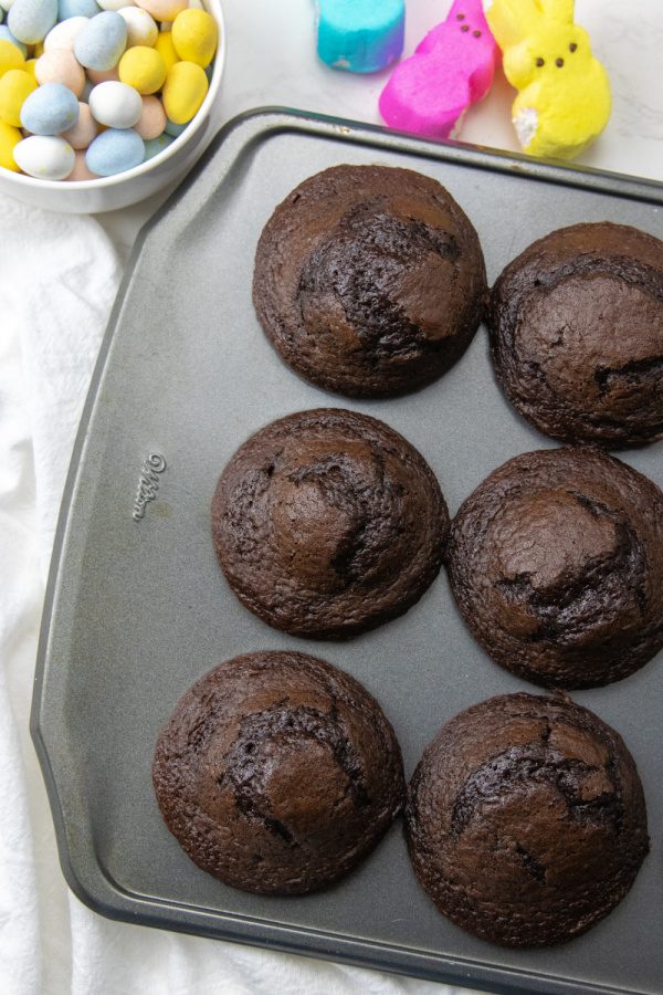 Peeps Easter Bunny Cupcakes are a chocolate cupcake with coconut and a marshmallow frosting. Top it off with a Peep, perfect for Easter! #passion4savings #peeps #easter #cupcakes #dessert #marshmallow #easy #cute #festive #fun #holidaydessert chocolate cupcakes into a pan