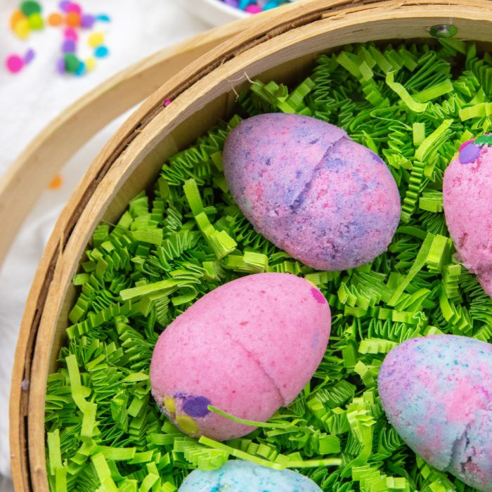 overhead shot of easter bath bombs in easter basket 