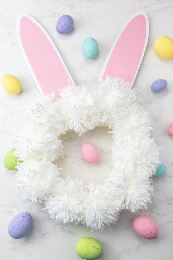 spring wreath bunny design with Easter eggs around it
