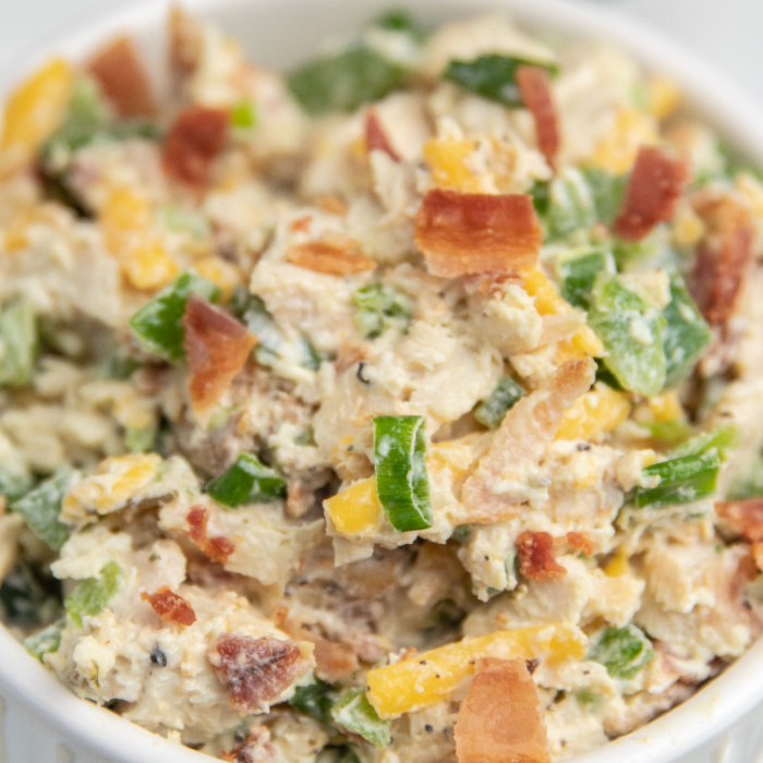 Jalapeño Popper Chicken Salad is a spicy and creamy chicken salad. Loaded with jalapenos, cheese, chicken, and more. A must make lunch idea. #passion4savings #chicken #spicy #jalapeno #popper #dinner #Lunch Jalapeño Popper Chicken Salad