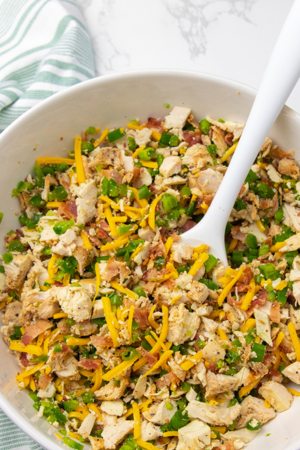 Jalapeño Popper Chicken Salad is a spicy and creamy chicken salad. Loaded with jalapenos, cheese, chicken, and more. A must make lunch idea. #passion4savings #chicken #spicy #jalapeno #popper #dinner #Lunch spicy chicken salad
