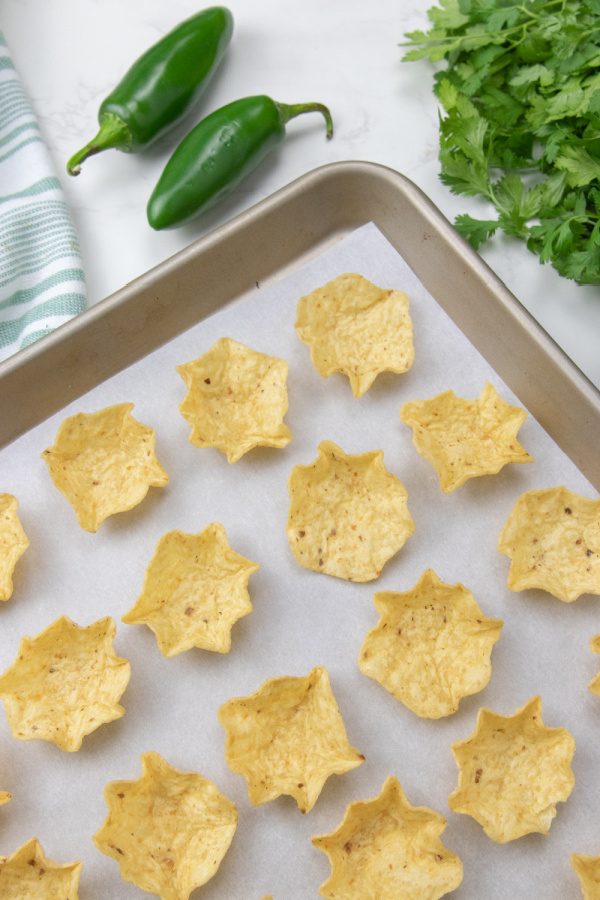 tortilla chips on a baking sheet 