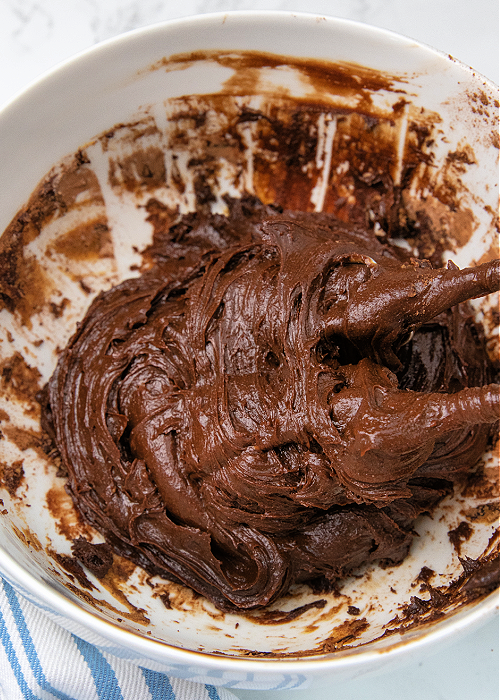 Brownie batter being mixed in a bowl