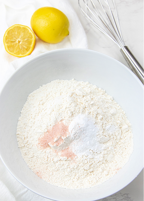 Flour, salt, and other ingredients in a white bowl