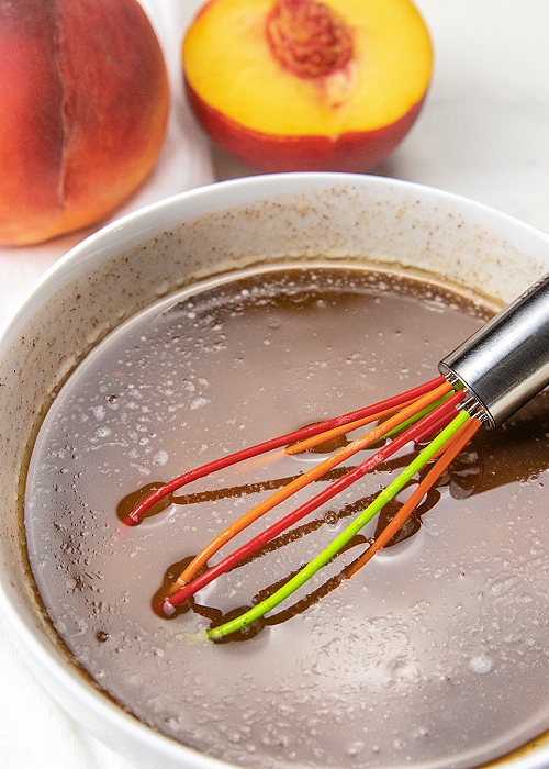 bowl of sauce for easy peach dumplings