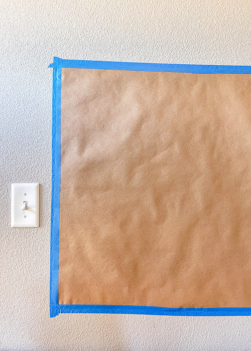 kraft paper taped to wall