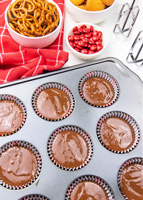 chocolate cupcake batter in a tin
