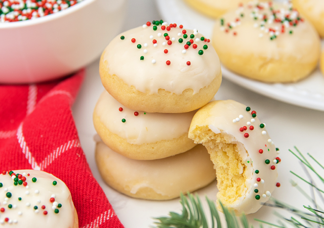 Delicious Italian christmas cookies, soft and cakey, dusted with covered in glaze, perfect for a festive celebration or holiday family gathering