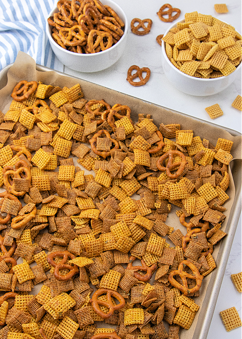 spicy garlic chex mix on a cookie sheet