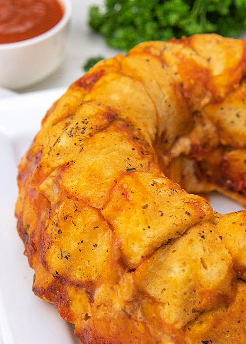 close up of pizza monkey bread on a platter