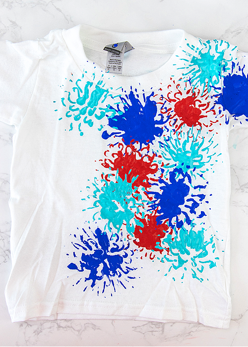 fireworks tshirt with red blue and aqua fireworks on it hand stamped