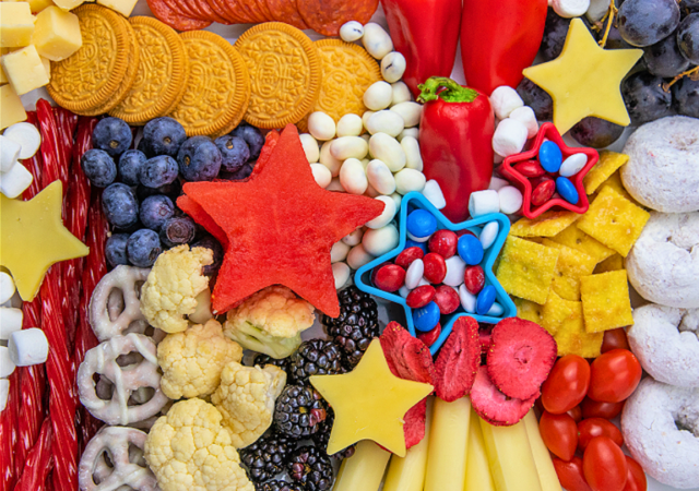 kid friendly food on a kid friendly 4th of july charcuterie board a patriotic snack for family parties