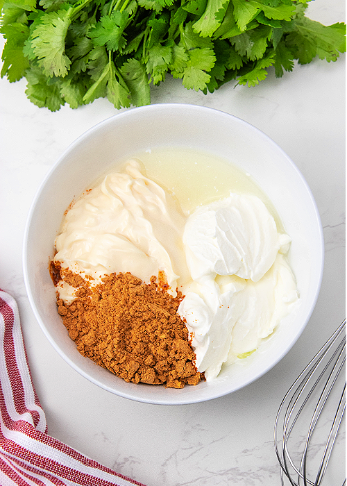 dressing for Easy Mexican Coleslaw being mixed in a bowl