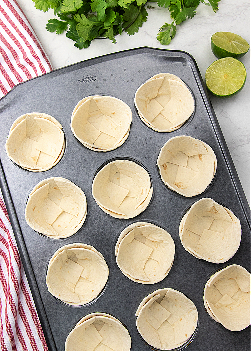 the base of taco cups in a muffin tin