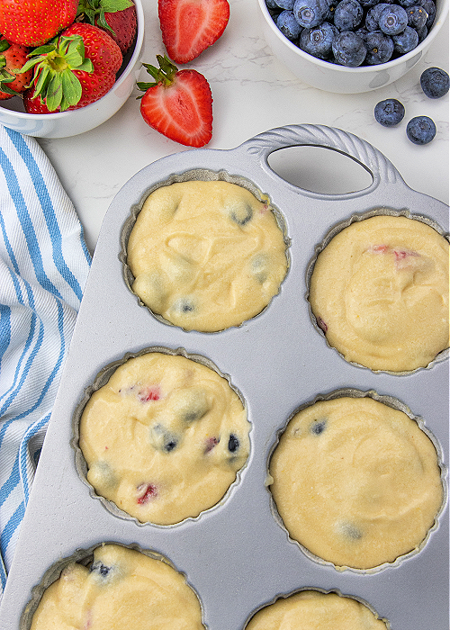 These Blueberry Strawberry Shortcakes are so flavorful, refreshing, light and perfect for all of your patriotic summer parties! bluebberry strawberry shortcake in a baking pan before baking