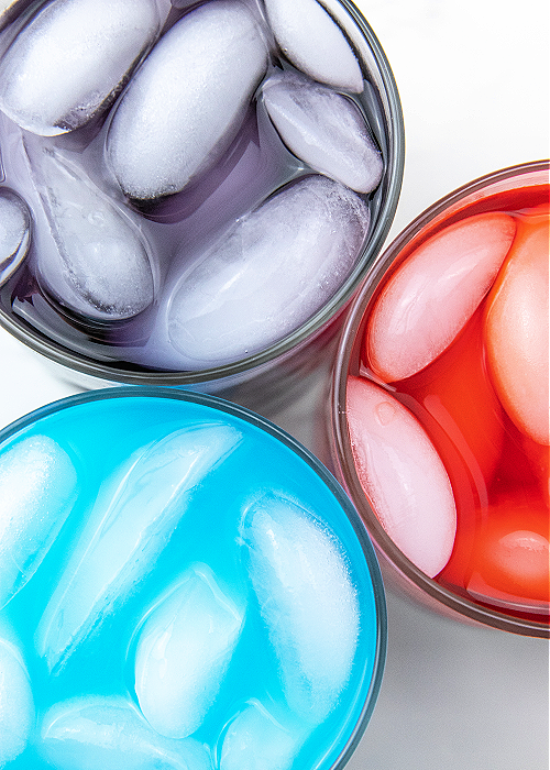 This Whipped Kool-Aid for kids is the perfect indoor activity when it's too hot outside. Or make it as a surprise treat! Children love it! three glasses of coolaid