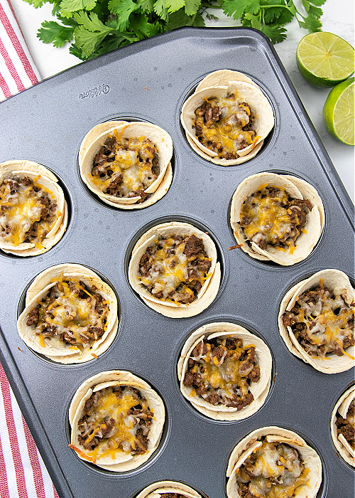 baked taco cups in a muffin tin without toppings