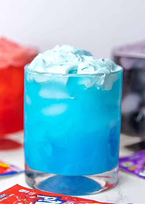 This Whipped Kool-Aid for kids is the perfect indoor activity when it's too hot outside. Or make it as a surprise treat! Children love it! whipped kool aid in blue