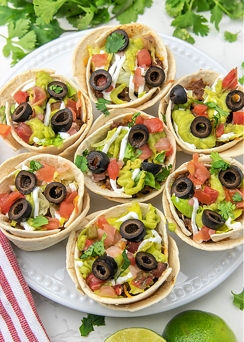 taco cups on a white serving platter