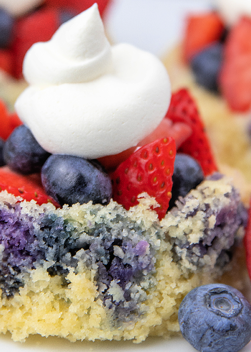 These Blueberry Strawberry Shortcakes are so flavorful, refreshing, light and perfect for all of your patriotic summer parties! blueberry strawberry shortcake with cool whip on top